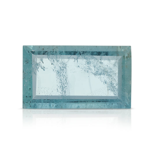 Portrait cut baguette aquamarine gemstone with natural inclusions, rectangular step-cut aquamarine in pale blue.