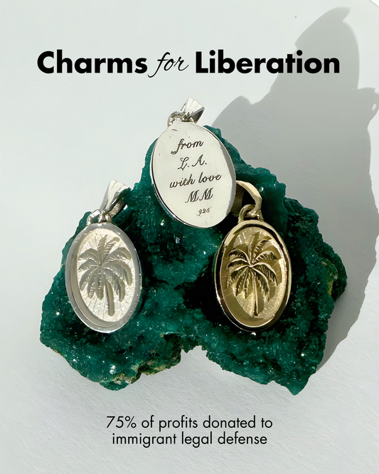 “Gold and silver palm charms from the Charms for Liberation collection by Michelle Minott Fine Jewelry, displayed on deep green raw crystal with engraved message ‘From L.A. with love, MM.’ Text overlay reads: ‘The making of Charms for Liberation.'