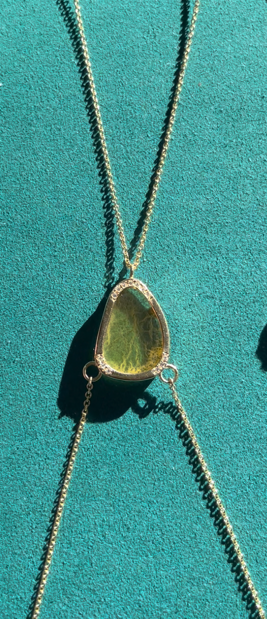 Close-up of 14K gold body chain featuring a polished yellow fluorite center stone surrounded by 1.5 ct white diamonds, handmade in Los Angeles.